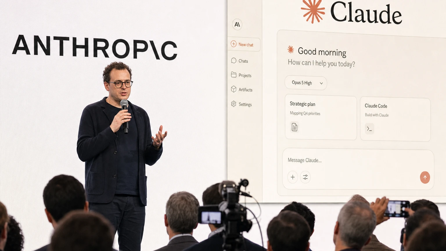 Anthropic CEO Dario Amodei speaking beside the company’s logo